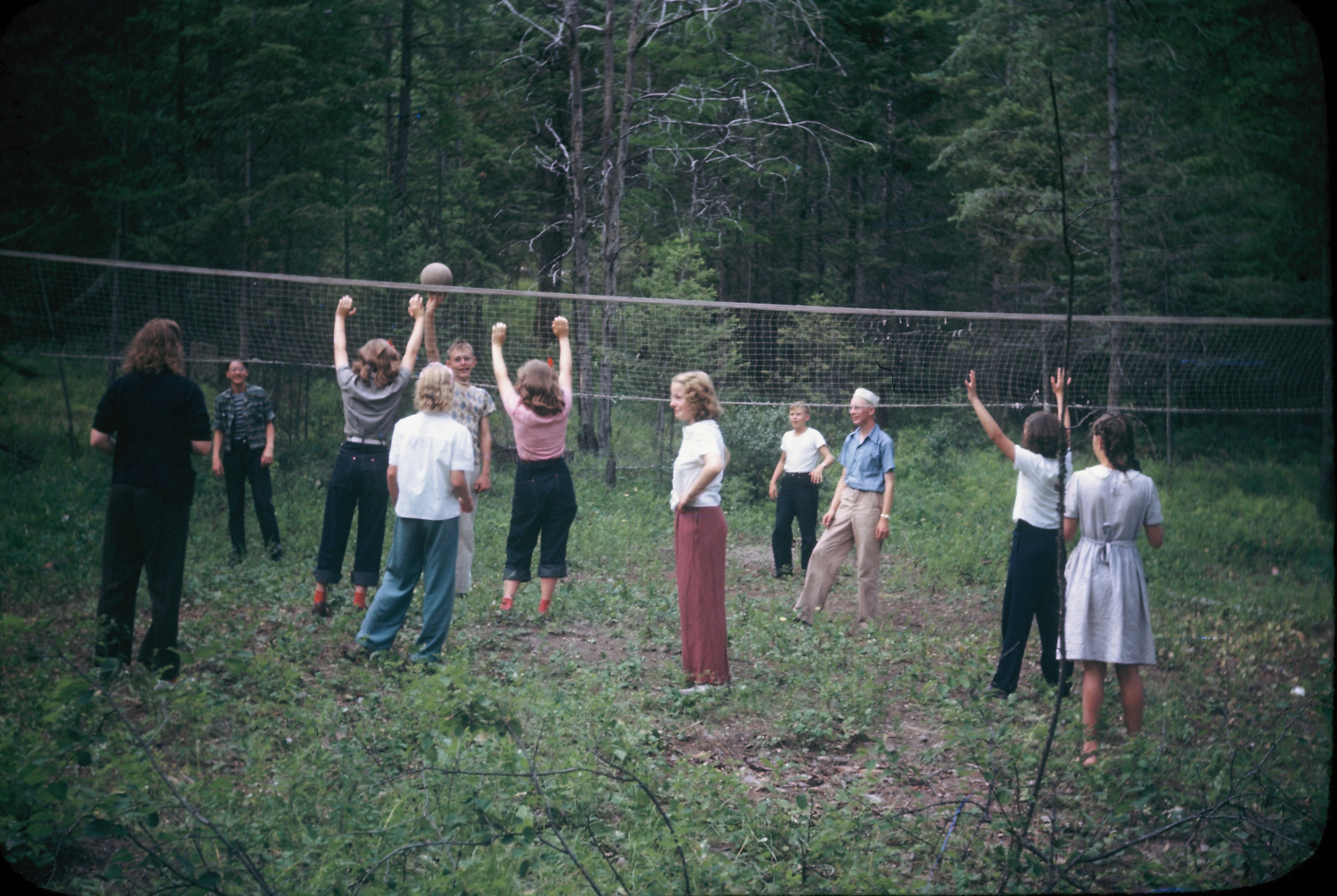 In 1946 volleyball games were held in front of the dining hall on rough terrain.