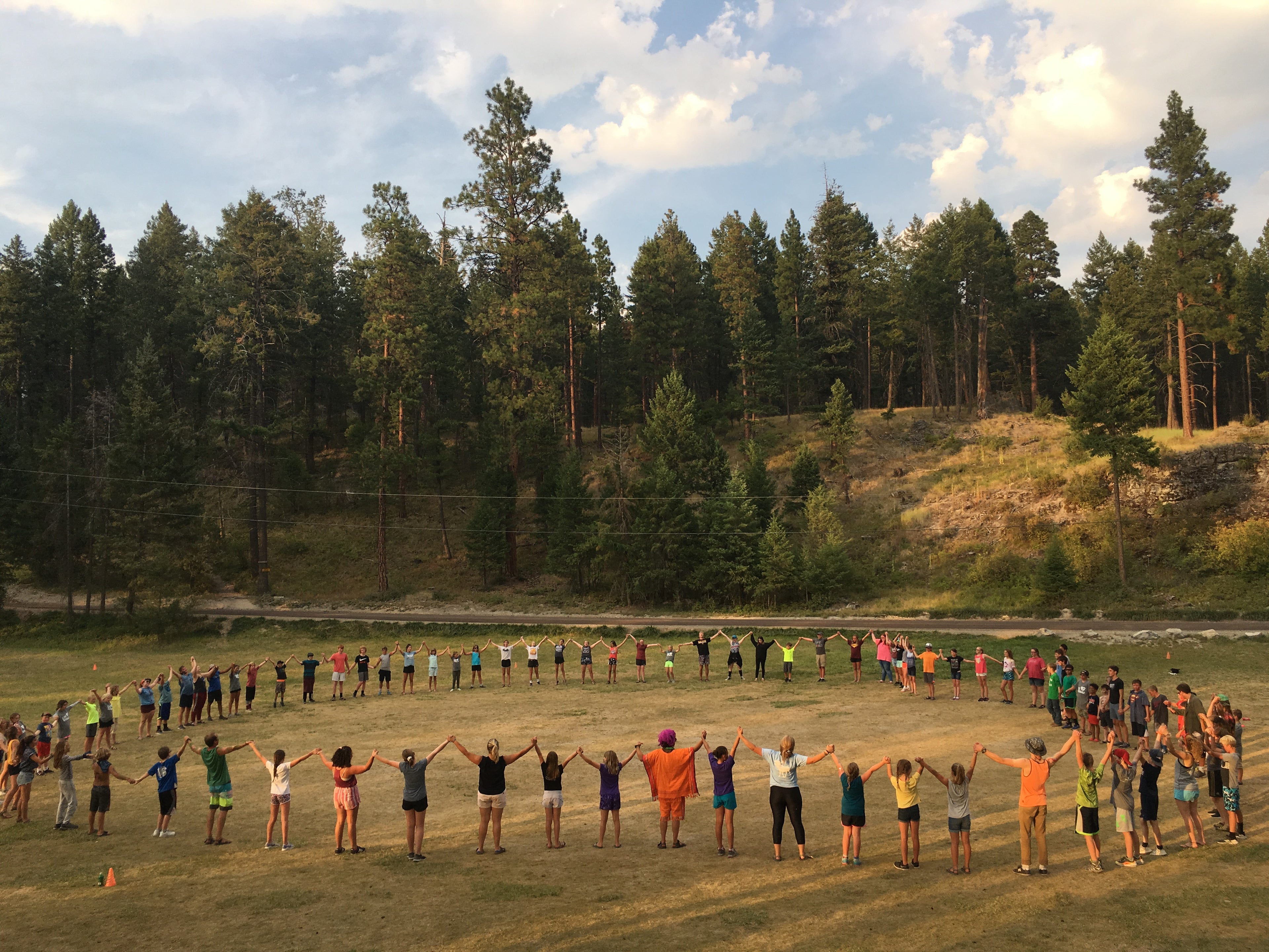 Campers lift their hearts and hands and voices in praise.