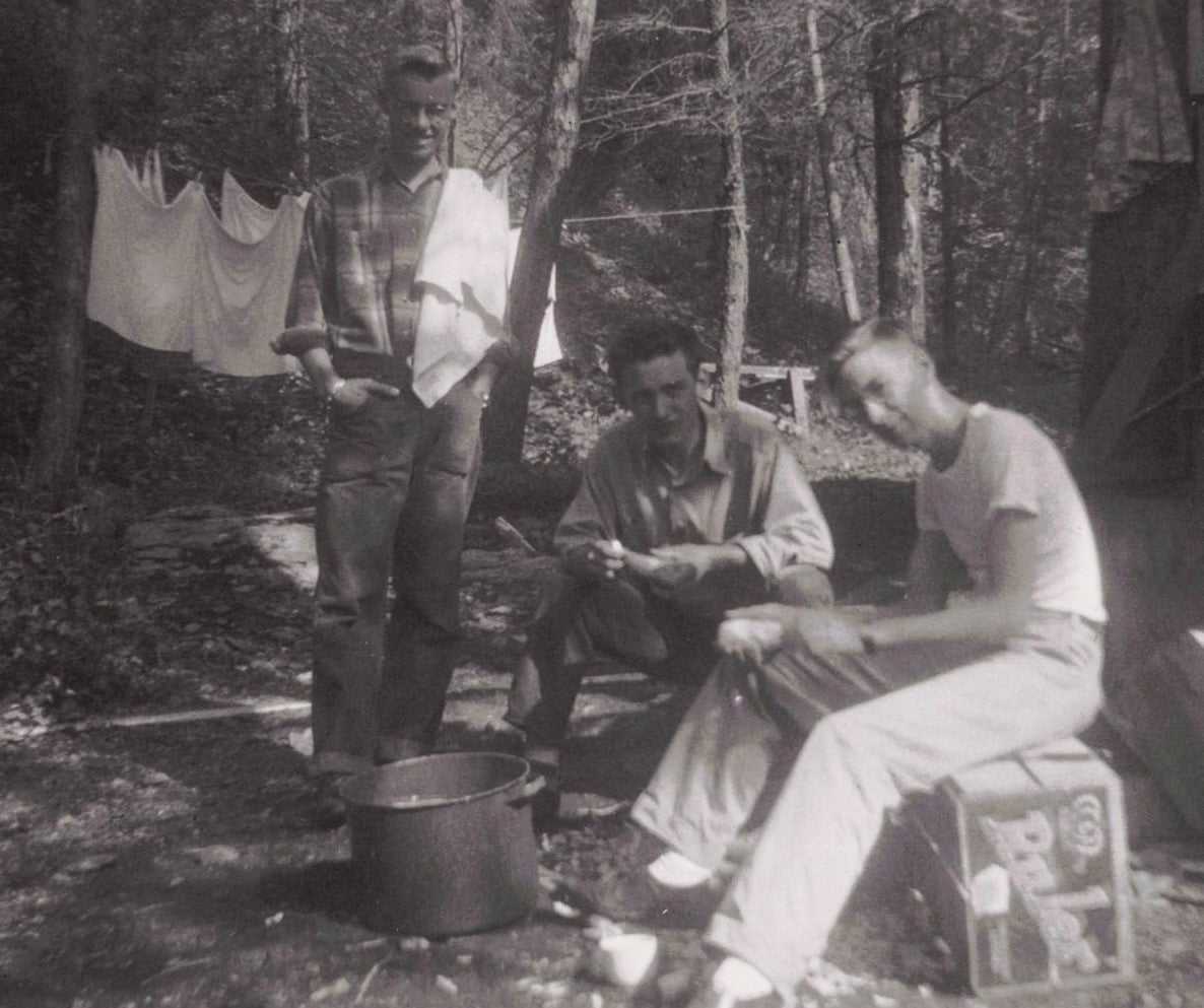 1947 Campers peeling potatoes for dinner