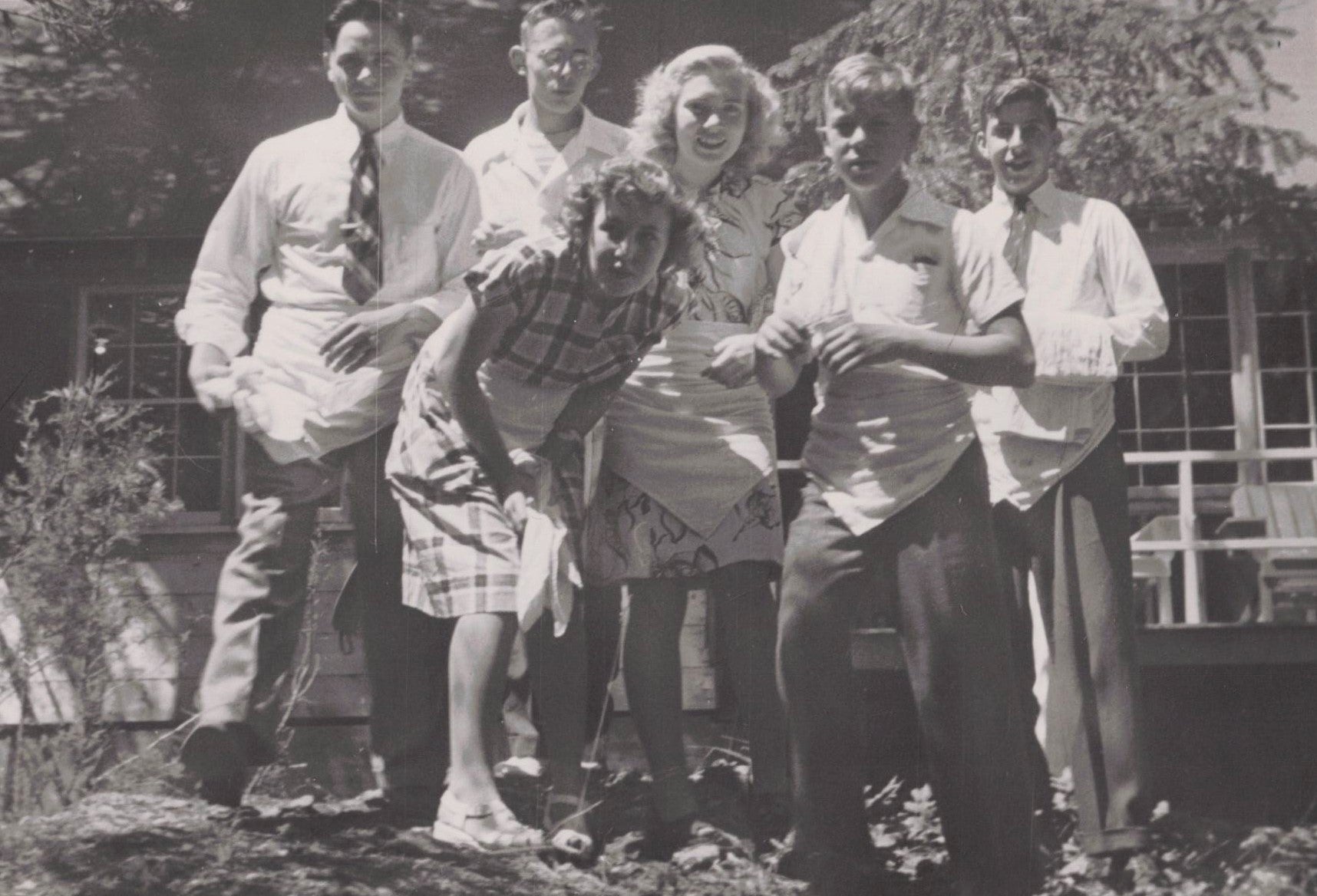 1947 Dressed up campers on kitchen duty